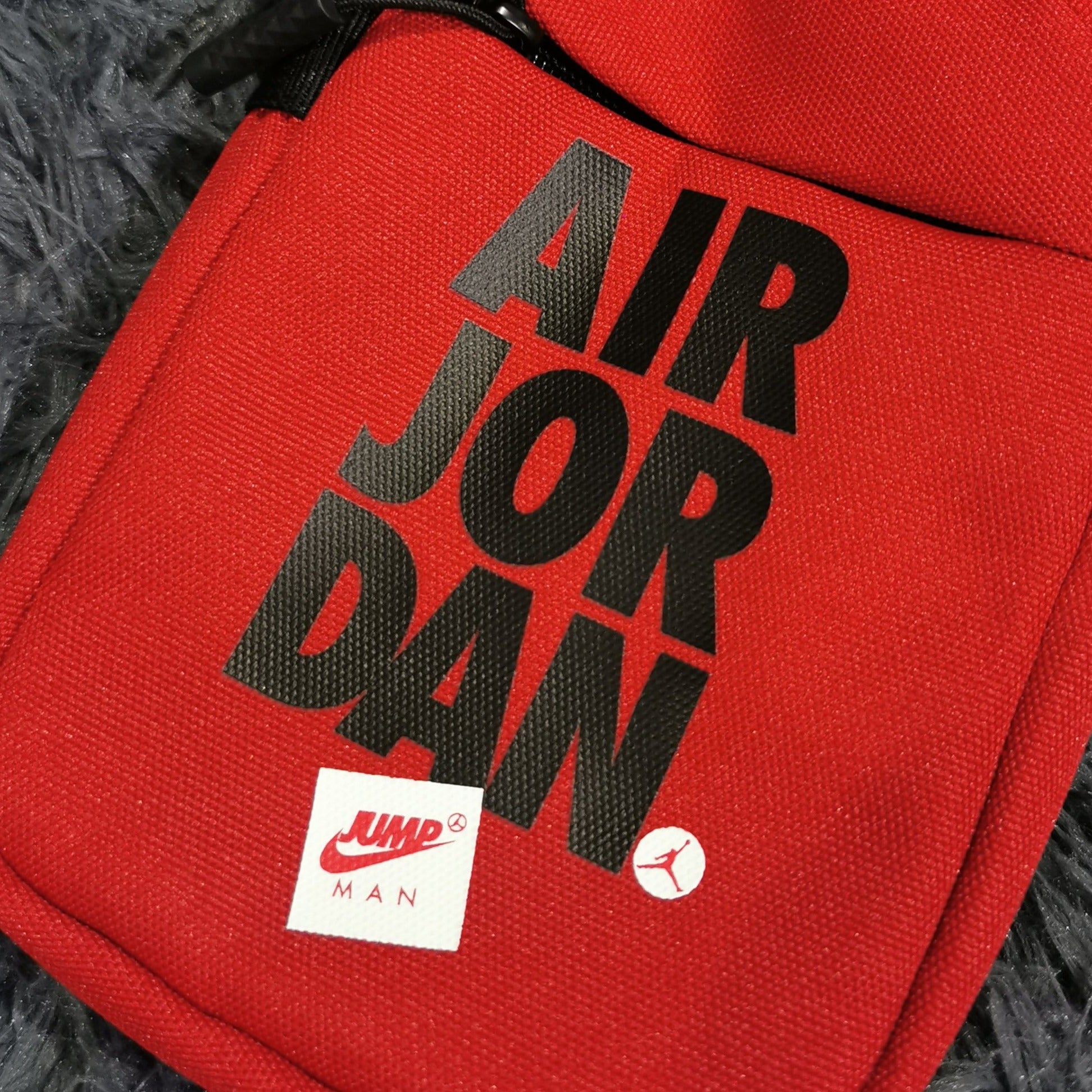 nike air jordan sling backpack Festival Bag Large zippered main compartment Front zippered pocket Padded and adjustable shoulder straps Side water bottle pocket Detachable storage pouch Top haul loop Spot clean The Jordan School Backpack is imported Jordan Airborne Air Jordan Sling