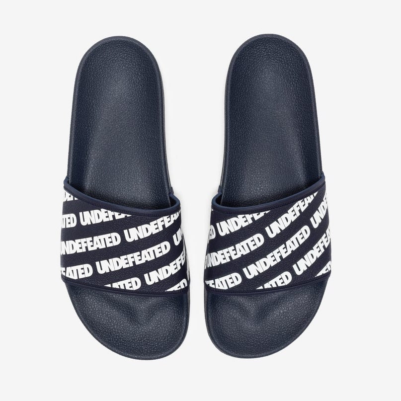 UNDEFEATED Repeat Slides (Navy/White) – Trilogy Merch PH